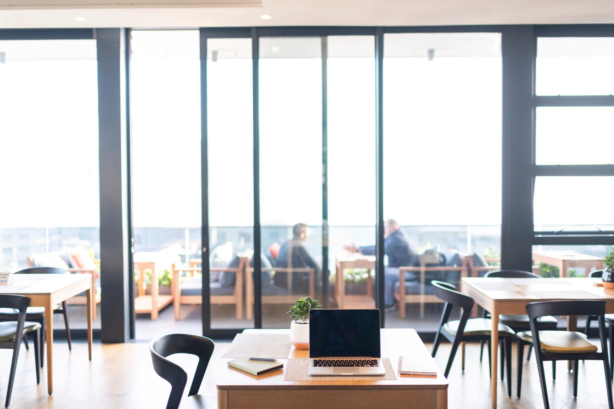 Quiet desk with laptop and notebook representing thoughtful app development